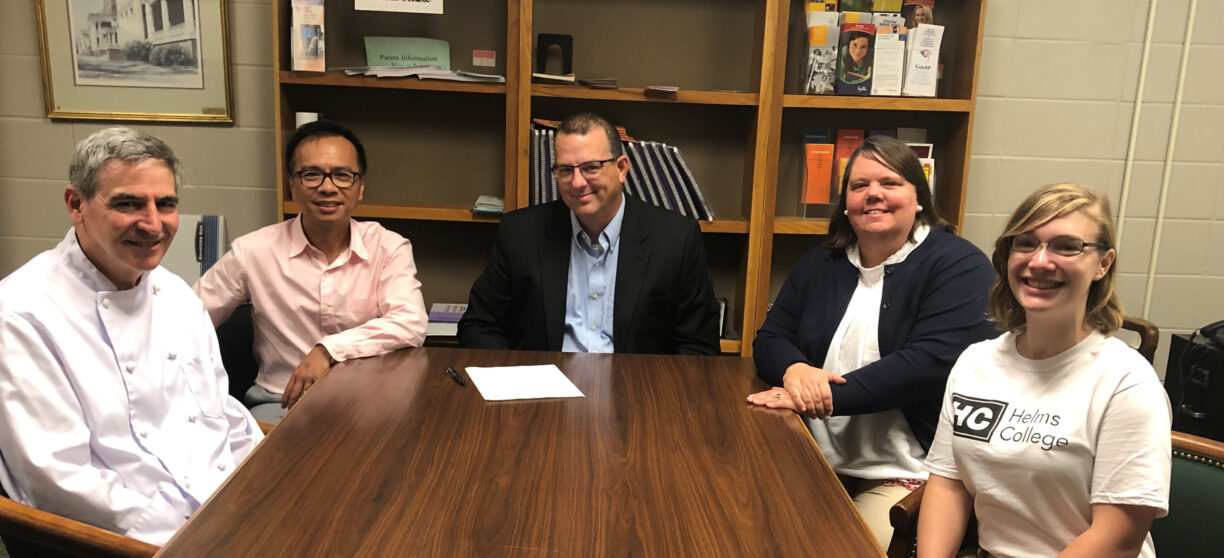 Photographed (l-r): Chef Gerard McGale, Culinary Arts Instructor at Baldwin High School, José Mallabo, Senior Vice President of Admissions at Helms College, Jason Flanders, Principal at Baldwin High School, Natalie Stowe CTAE Director at Baldwin High School, Kelly McWilliams, Recruiter and Content Marketing Manager at Helms College.