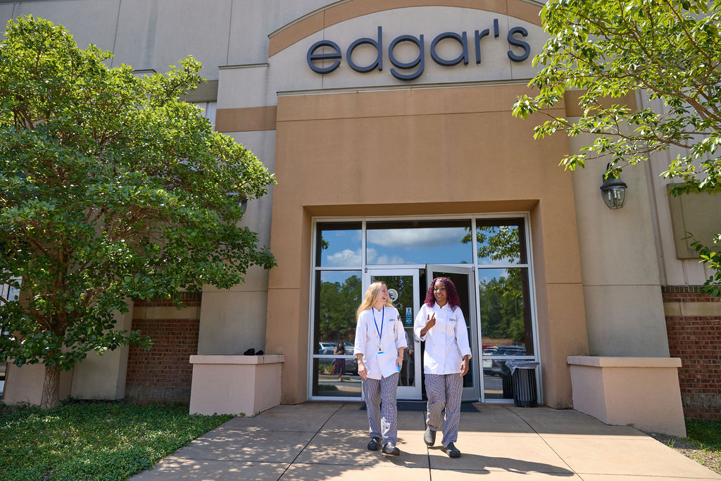 Two Helms College students walk out of Edgar's Bistro in Macon.